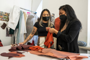 Fashion Design professor and student reviewing work in the studio
