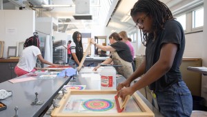 SADI students working in the printmaking classroom.