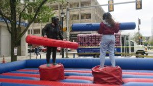 Inflatable jousting on Fall Convocation Day.