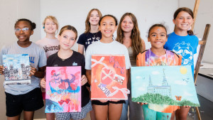 YAW 2025 students showing off their art.