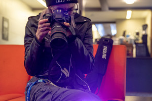 student taking a picture of a lemon with a really nice camera