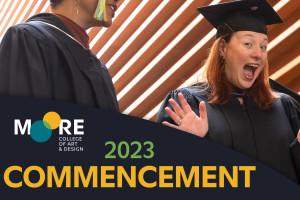 2023 Commencement video thumbnail showing a graduate waving excitedly at the camera