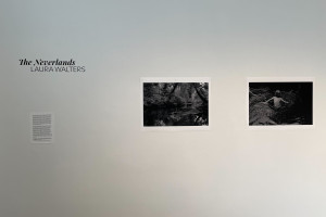 "The Neverlands" Laura Walters on a gallery wall with two black and white photographs next to it