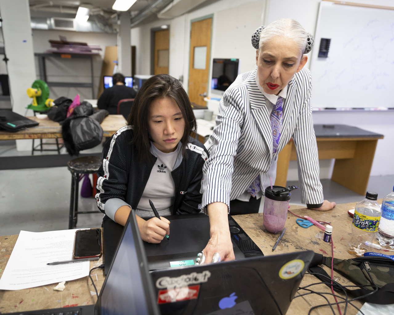 Heather Ujiie and a Moore student working in a classroom