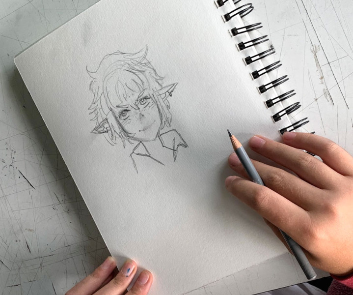 Overhead photo of a YAW student's character design sketch